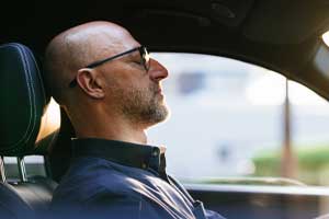 Man sitting in car