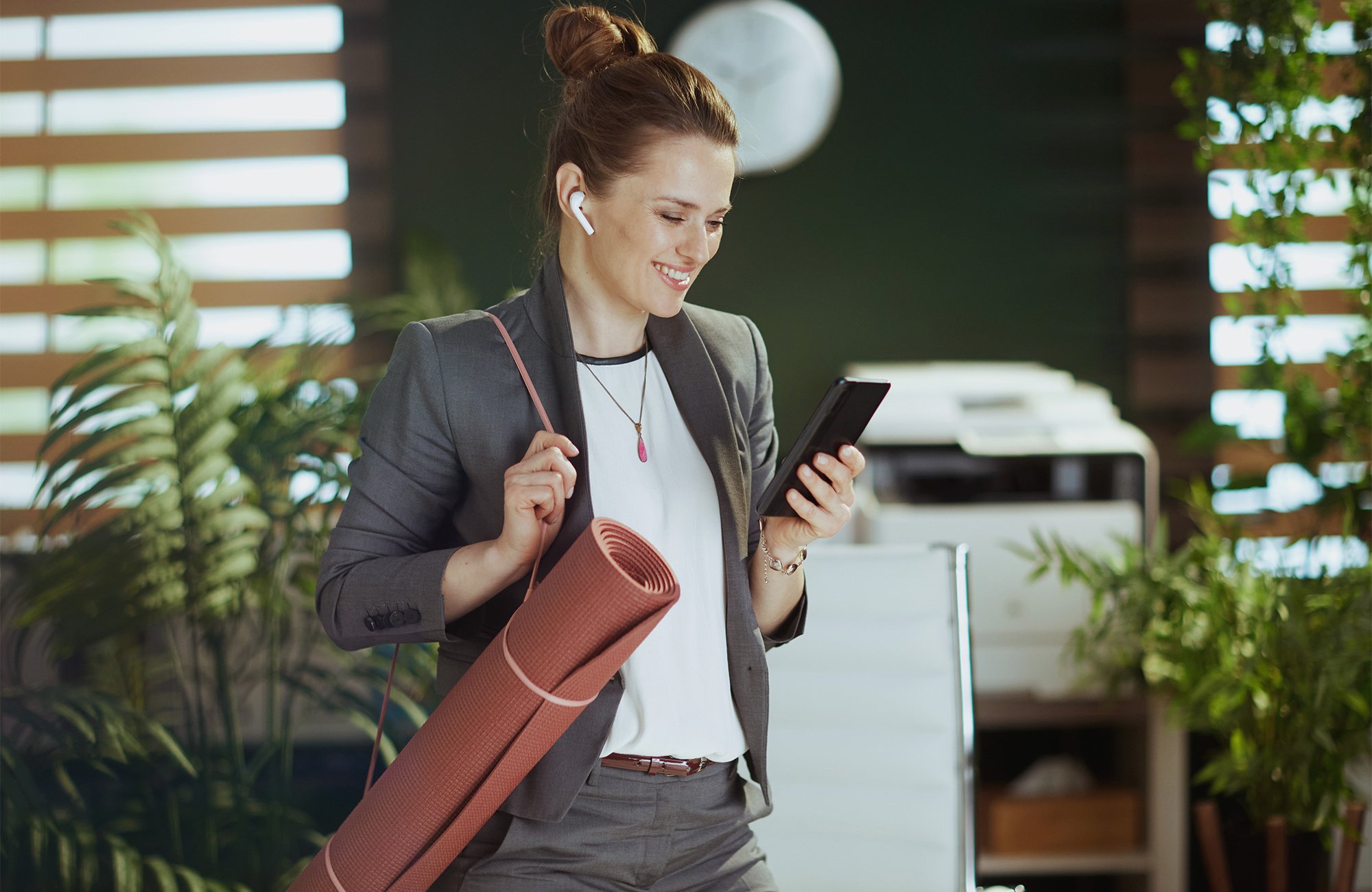 Woman at work with yoga mat